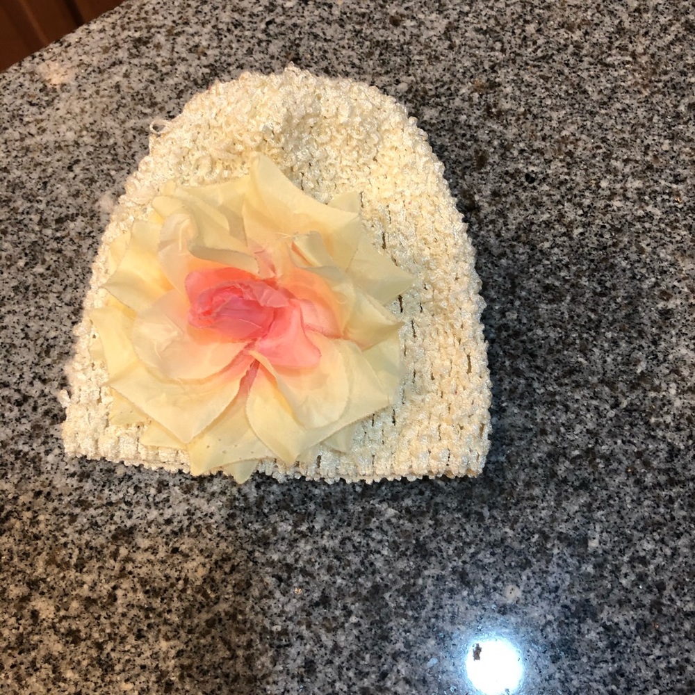Newborn girl baby first photo hat rose flower